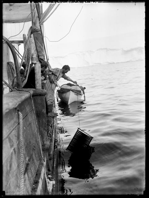 Frank Hurley washing cinematograph film on the "Aurora", 1912