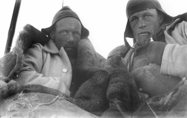 Wild and Watson in sleeping bag tent on sledge journey, 1912