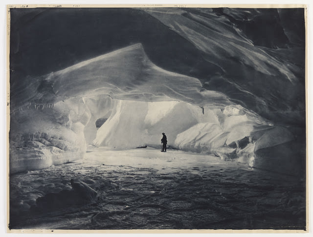 Cavern carved by the sea in an ice wall near Commonwealth Bay, 1912