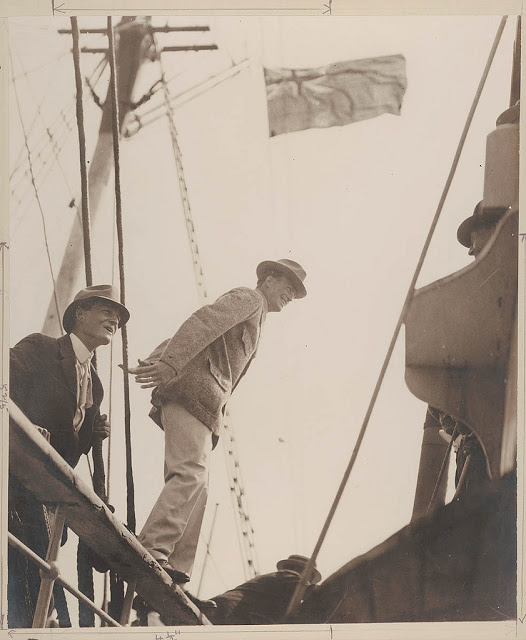 Madigan at the rail and Mawson stepping from the rail of the Aurora, 1911-1914
