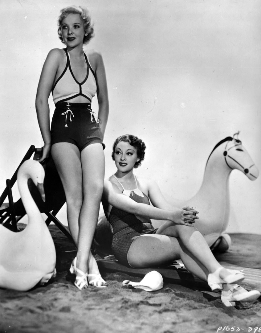 Actresses Ida Lupino and Kathleen Burke model the latest swimwear, 1935