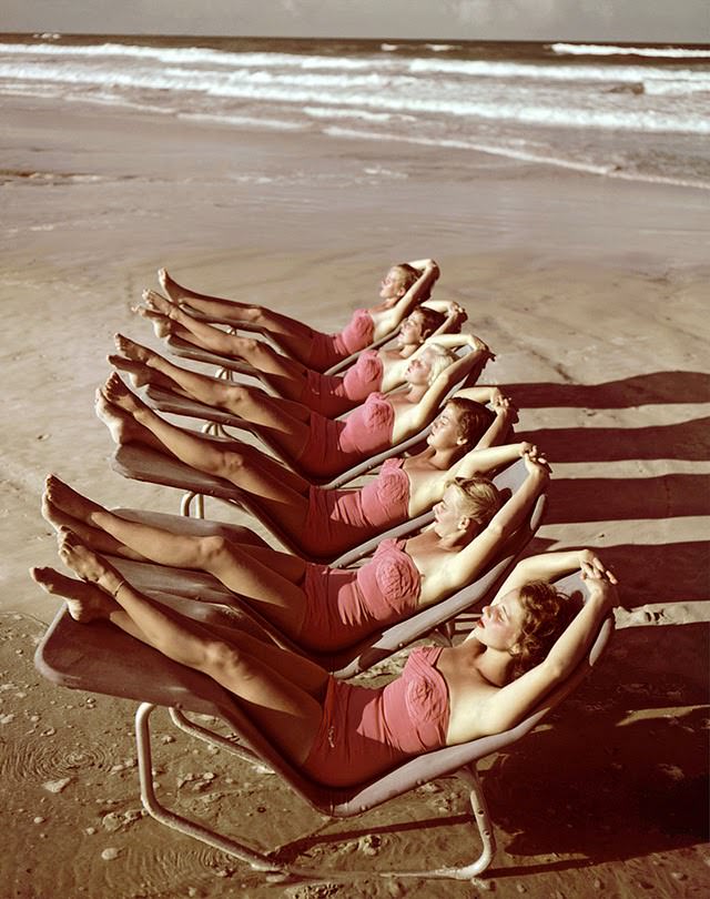 A group of southern belle models sunbathe on the beach at Cypress Gardens theme park, Winterhaven, Florida, 1953