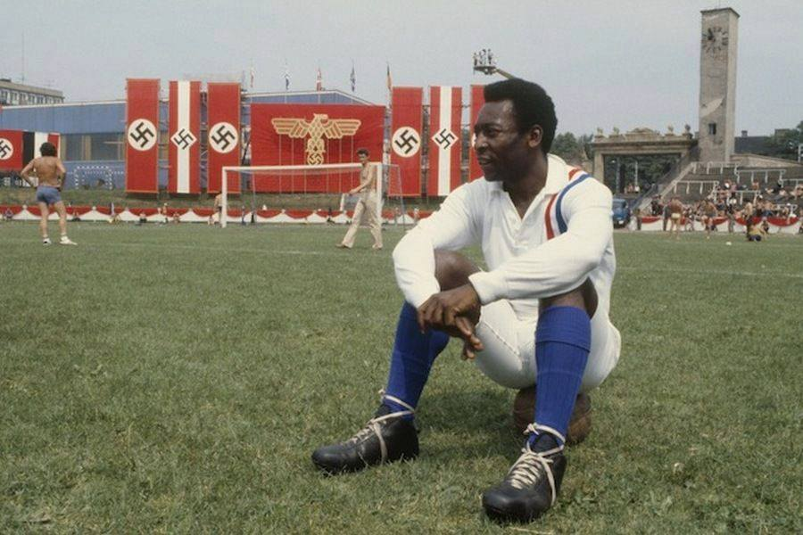 Pelé takes a break during the filming of "Escape to Victory", 1981