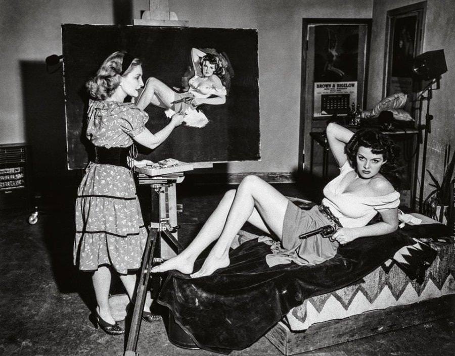 Jane Russell posing for artist Zoe Mozert for the poster for the film “The Outlaw”, 1943