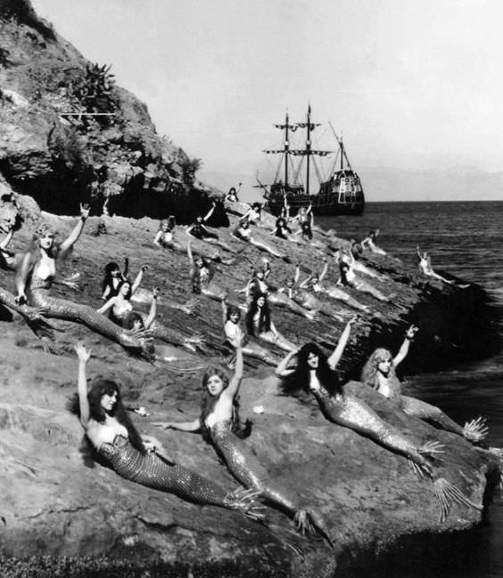 Actresses playing mermaids lounge during the making of Peter Pan, 1924