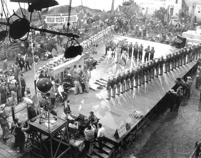 Busby Berkeley directs Judy-Garland and Mickey Rooney in MGM’s film "Girl-Crazy", 1943