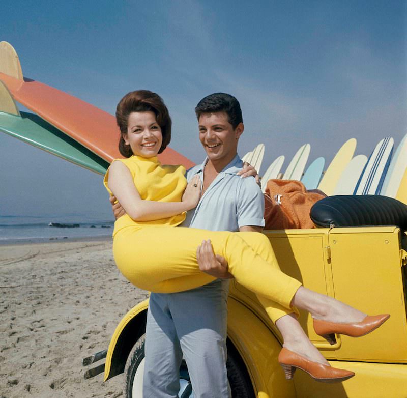 Actress Annette Funicello and singer Frankie Avalo on beach during filming of "beach Party", 1963