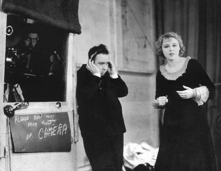 Alfred Hitchcock on the set of the film Blackmail with actress Anny Ondra, 1929