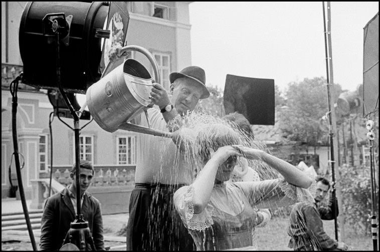 Julie Andrews is doused with water during filming of The Sound of Music, 1964