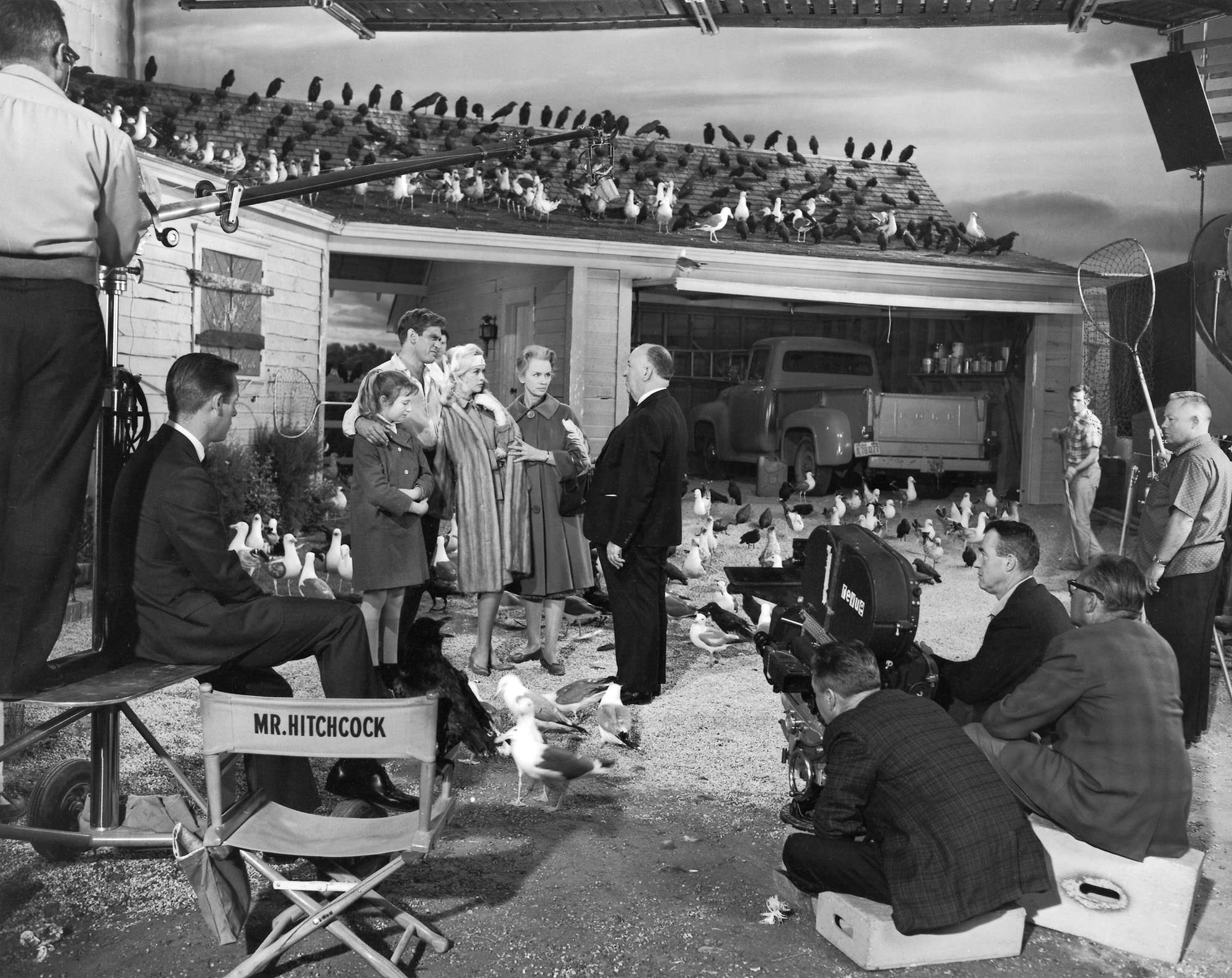 Director Alfred Hitchcock on set during the filming of "The Birds", 1962