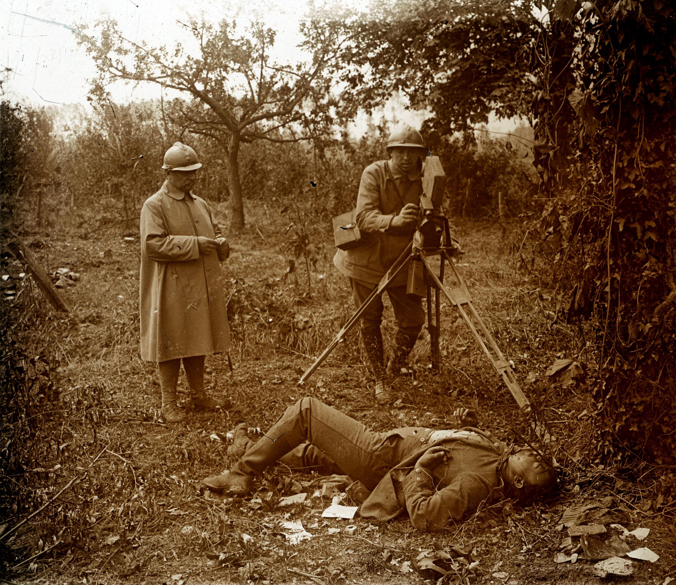 A filmmaker filming at the corner of a battlefield at The Somme, during the Great War, in 1916