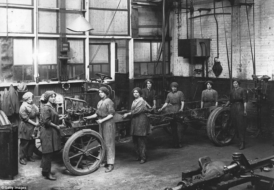 As this 1917 photograph shows, female war workers didn’t just run trains and buses – they fixed and maintained them too.