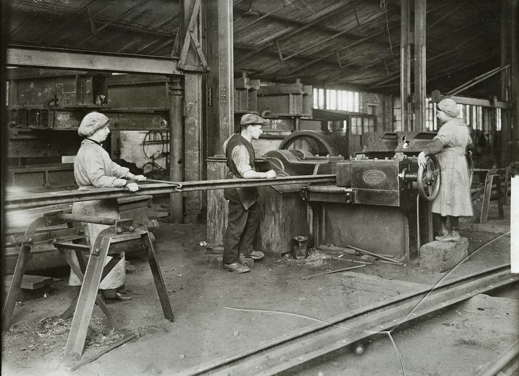 Women straightening and bending steel girder