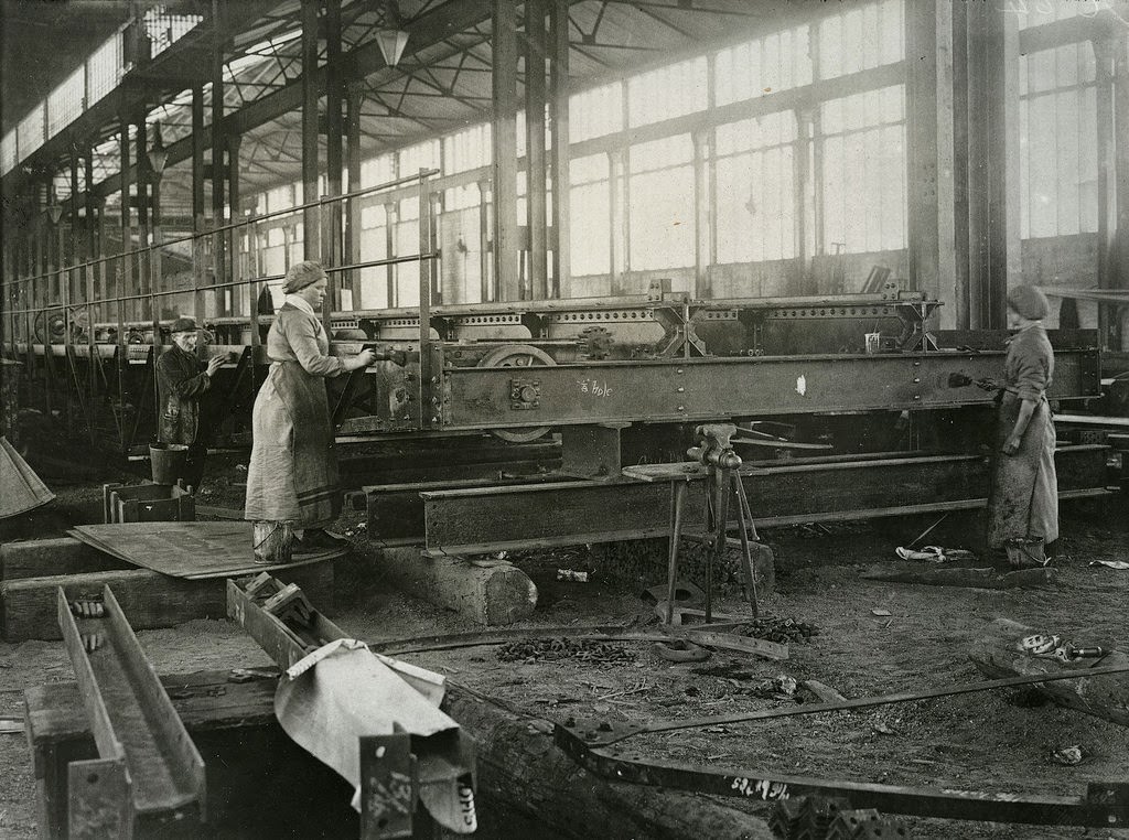 Women painting steel work