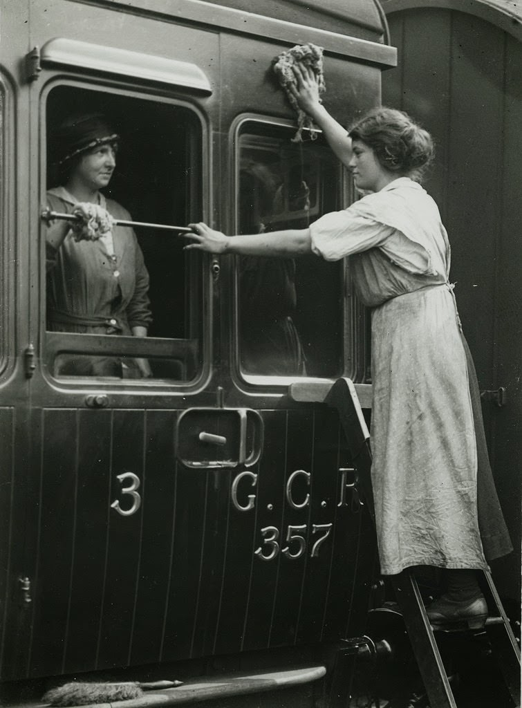 Railway workers cleaning carriages