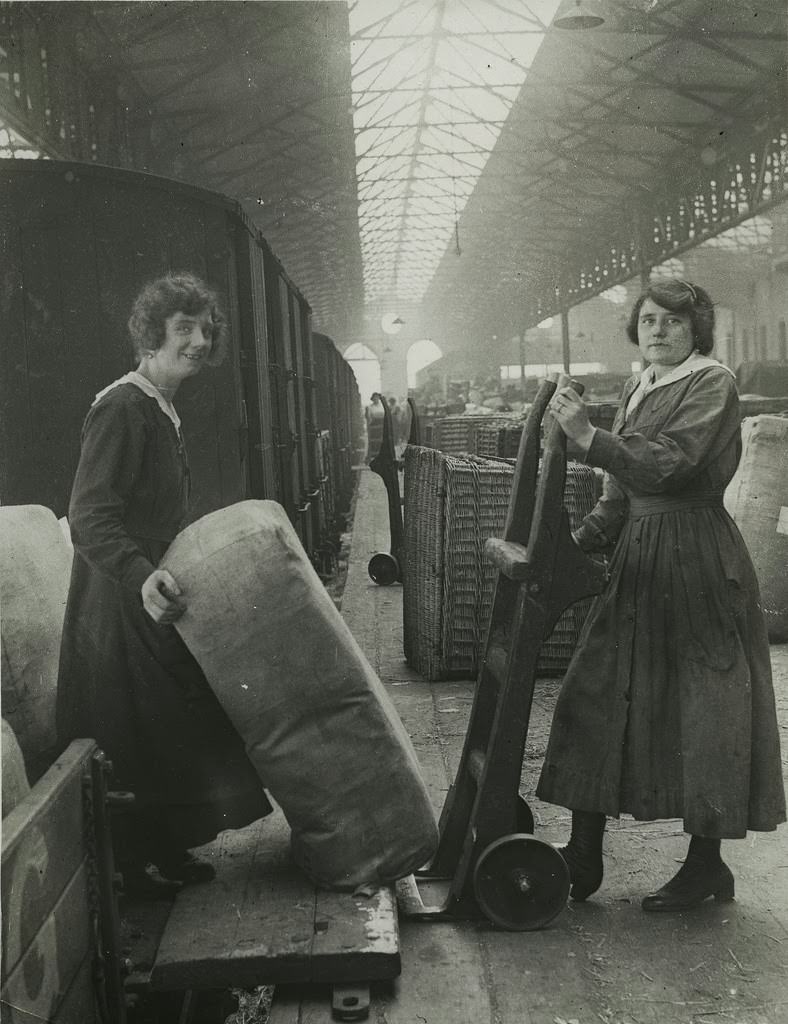 Railway workers unloading goods from train