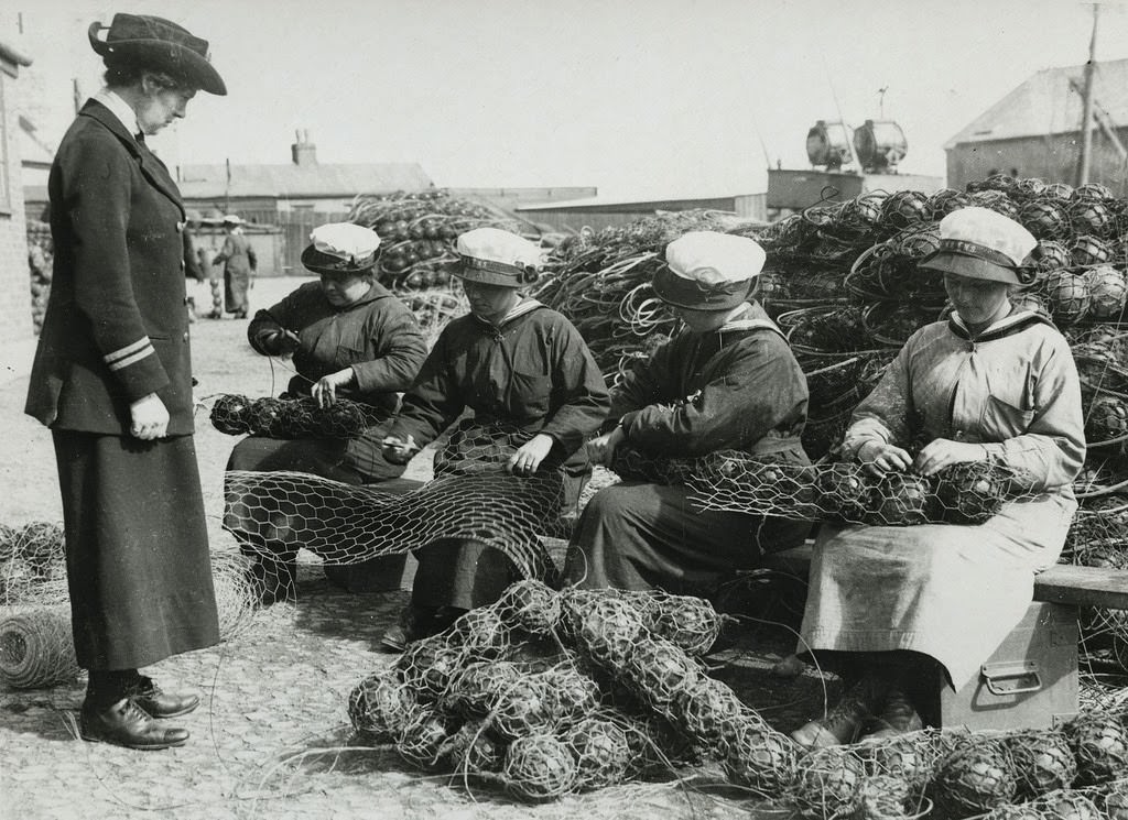 Mine net workers wiring the floats together