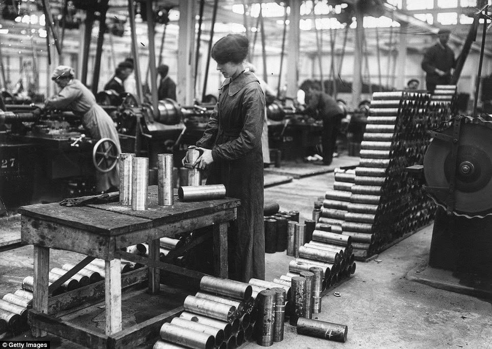 950,000 female workers were employed in British factories, including this worker, pictured making shell cases in a Vickers factory in January 1915 .