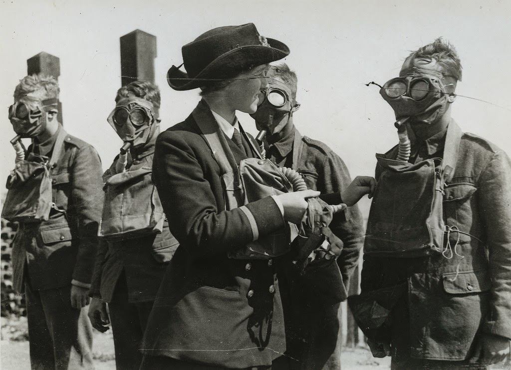 W.R.N.S. instructor at respirator and mask drill for military recruits