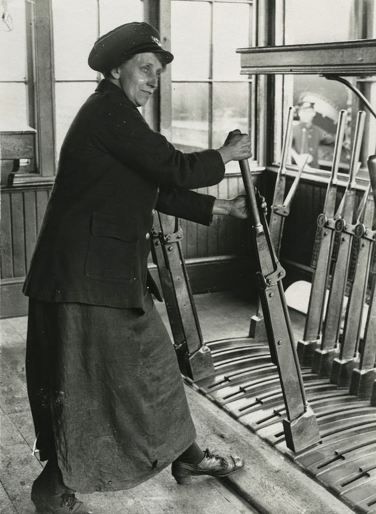 Railway worker pulling signal box levers