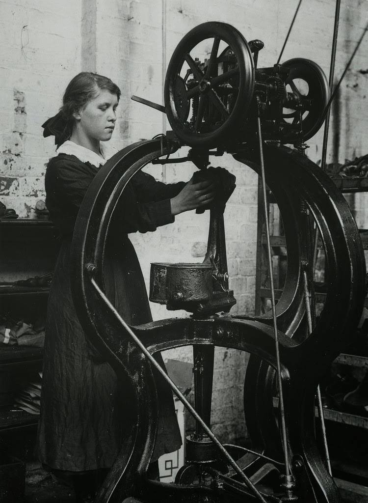 Girl operating stitching machine in Leicestershire boot factory