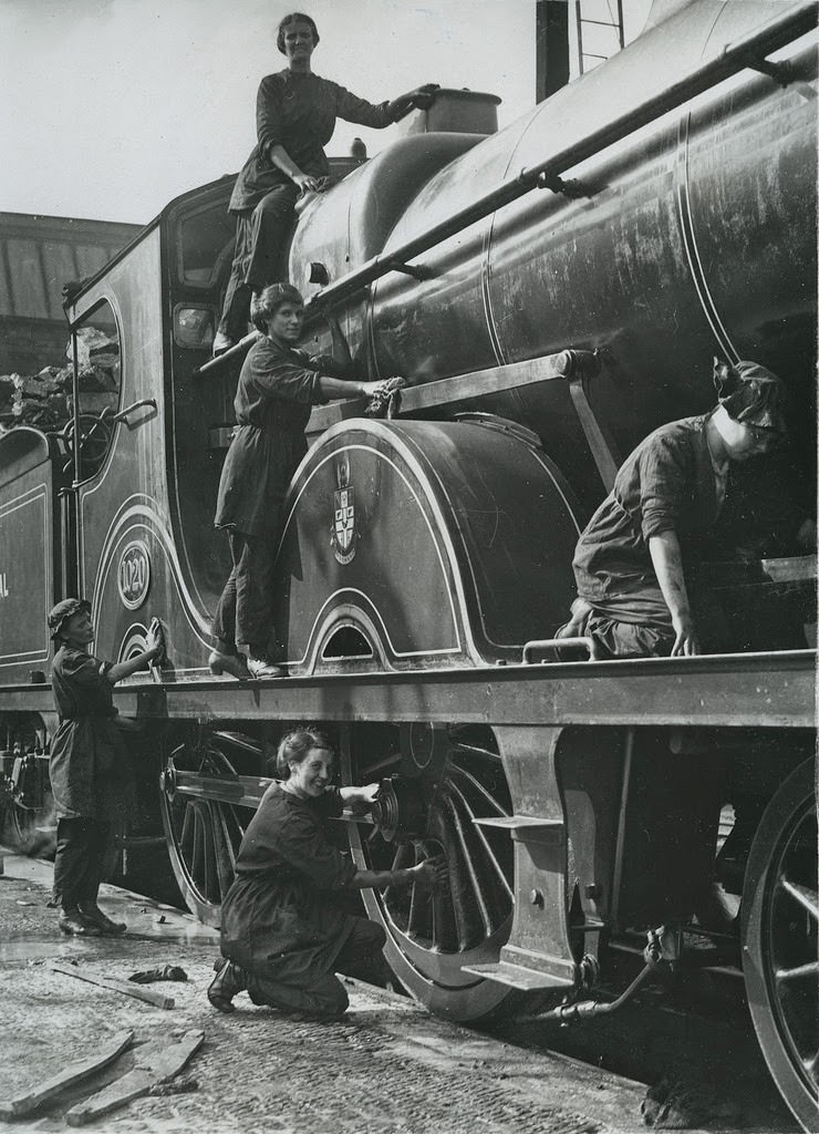 British women cleaning locomotive in Midlands