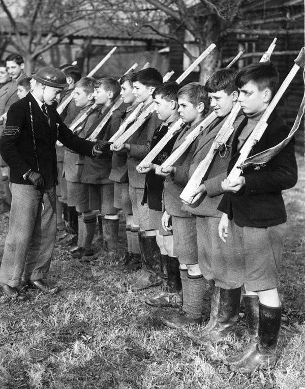 A young "Sergeant Major" inspects some British schoolboys who have been evacuated to Kent at the start of the war, 1939.