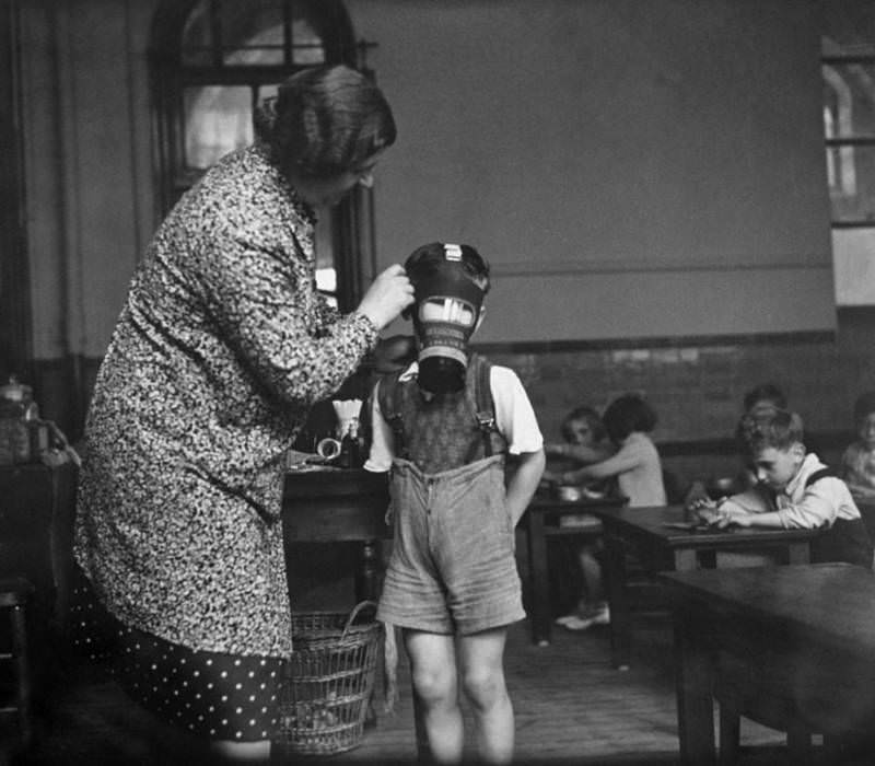 Father Christmas hands out toys and games, including a set of building bricks, to children at a home for evacuees in Henley-on-Thames, England, 1941.