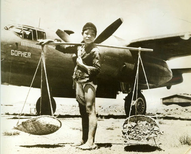 Chinese boy helps build airfield