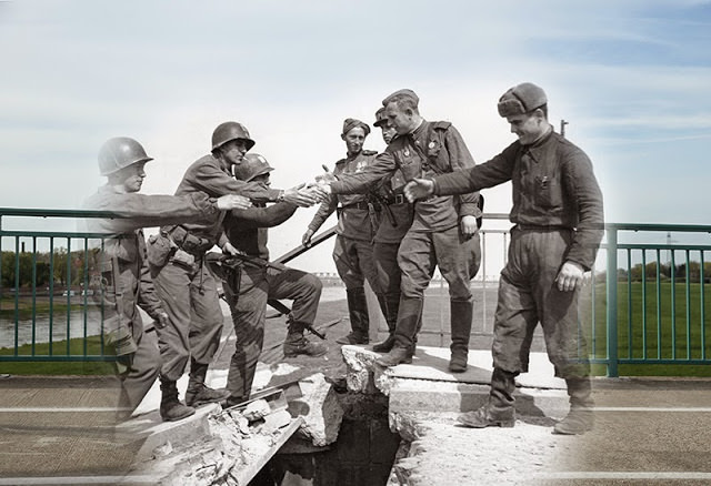 THEN: U.S. (L) and Soviet troops greeting one another on a damaged bridge over the Elbe River towards the end of World War II on April 26, 1945 in Torgau, Germany. NOW: A view on the same bridge from the same perspective on April 29.