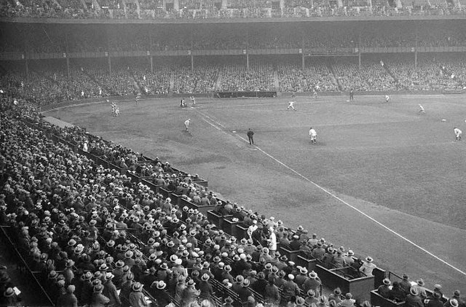 Yankee Stadium overcrowded with people wearing hat, 1926