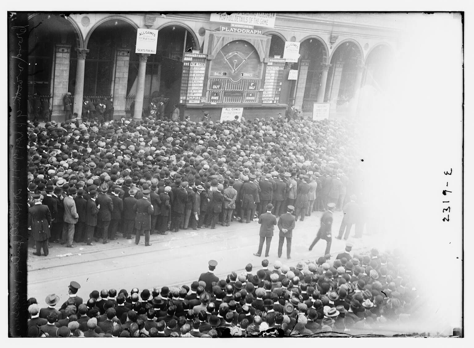 Fans following a 1911 World Series game on a "playograph" in NYC