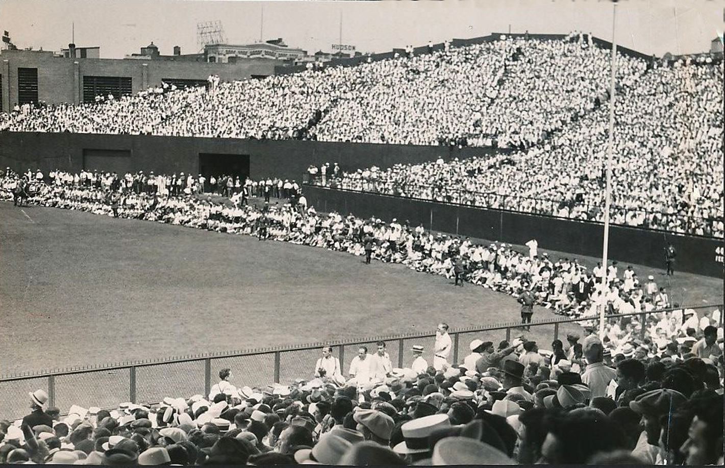 Boston's New Fenway Park overcrowded, some fans are sitting in the outfield, 1934