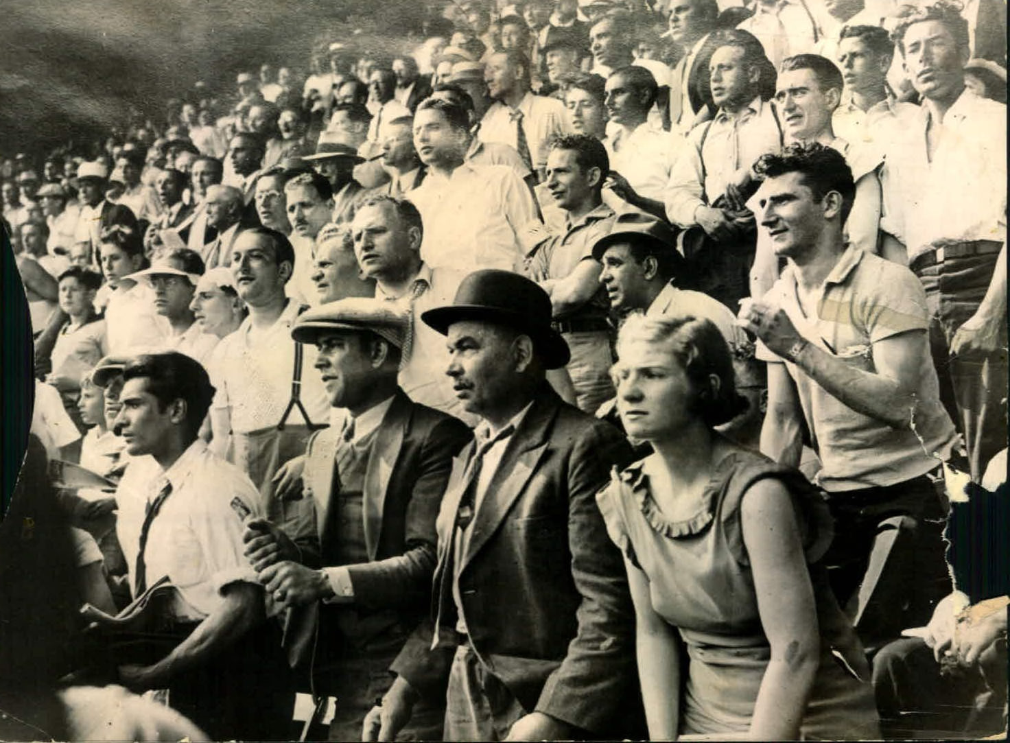 Baseball fans paying full attention in the game, 1940s