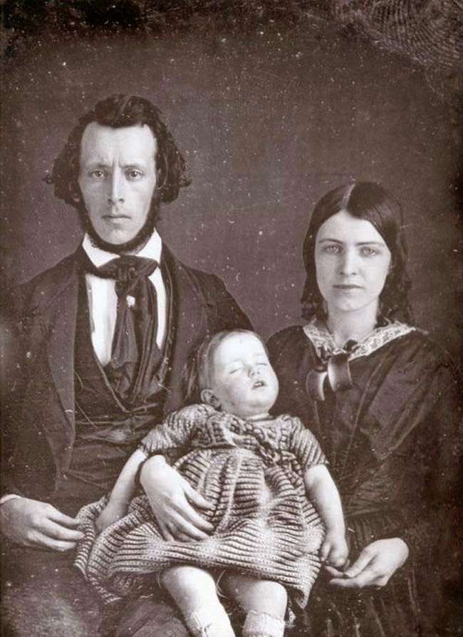 The pain in these parents' faces as they hold their dead child is obvious.