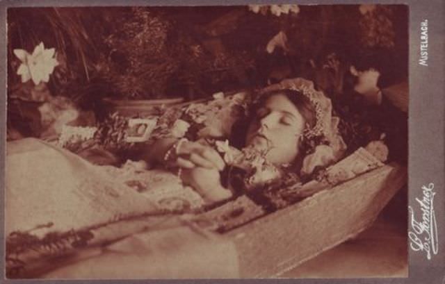 Deceased girl in casket.