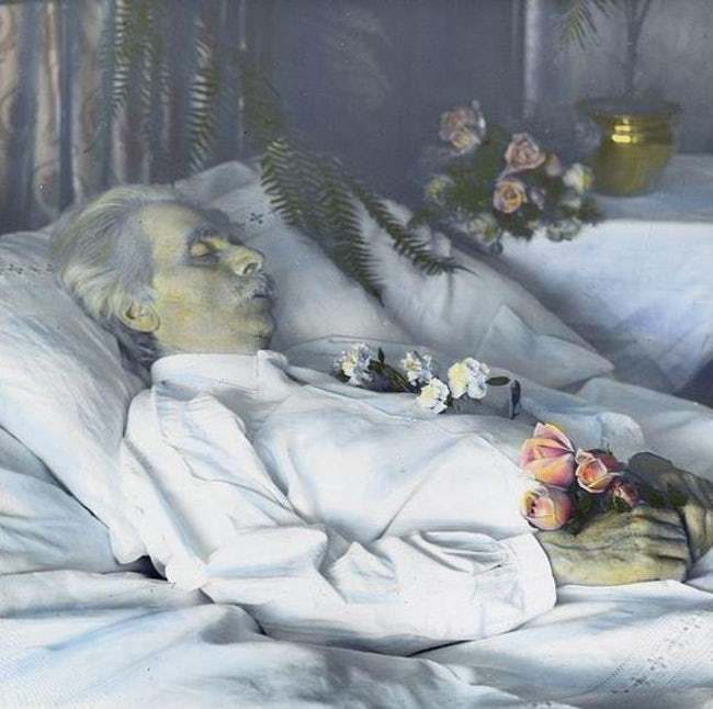 Deceased man with flowers