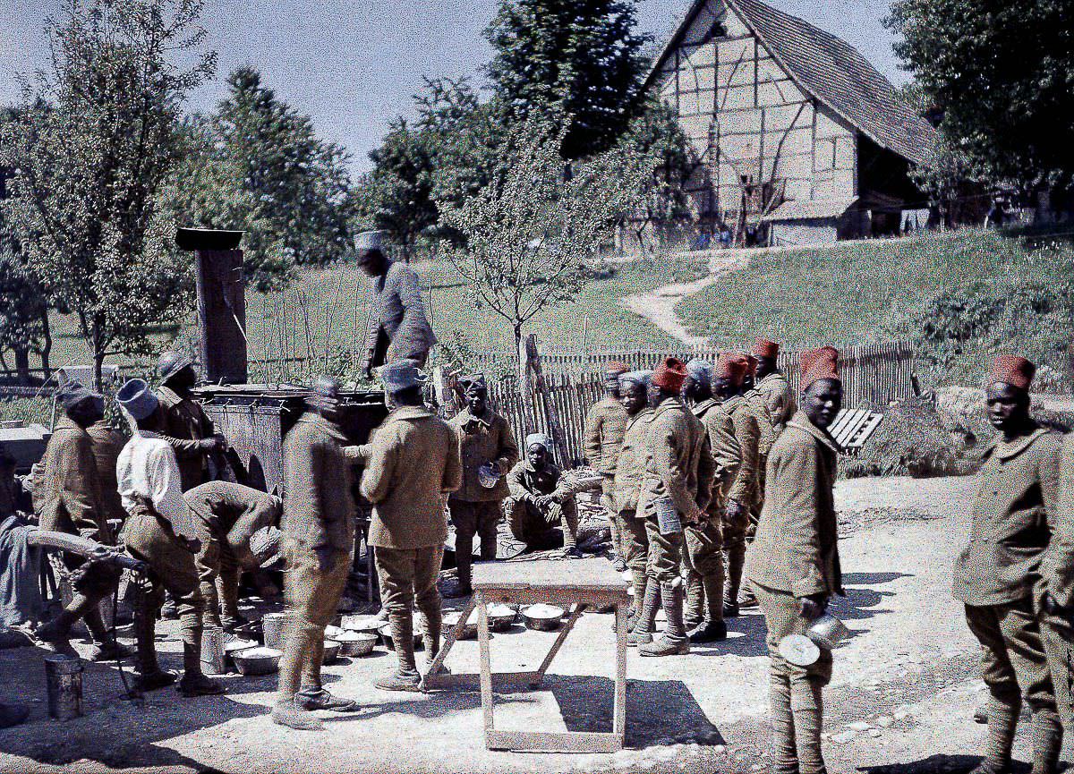 Senegalese soldiers in the French Army line up for lunch in Saint-Ulrich, France, 1917