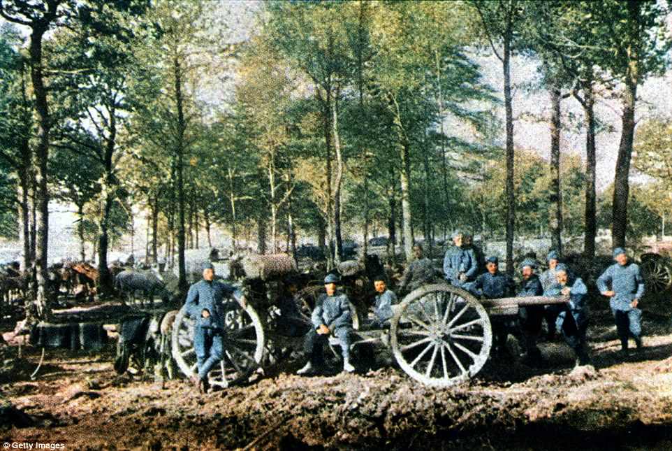 A group of French artillerymen with 75 mm guns on the Western Front, 1916