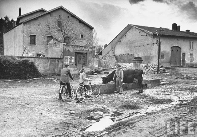 Ernest Kreiling and his bride talking with a French farmer during their tour of battlefields.