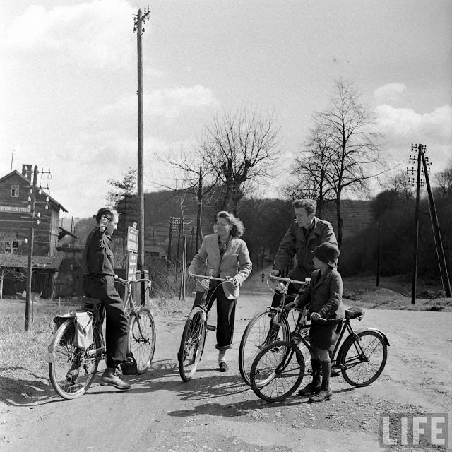 Ernest Kreiling and his bride asking local for directions.