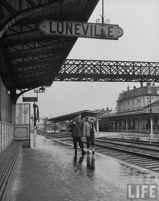 Ernest Kreiling walking on platform of train station with his bride.