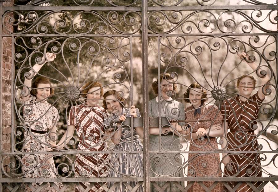 Students from five states smile through the gate of Ashley Hall in Charleston, South Carolina, 1939