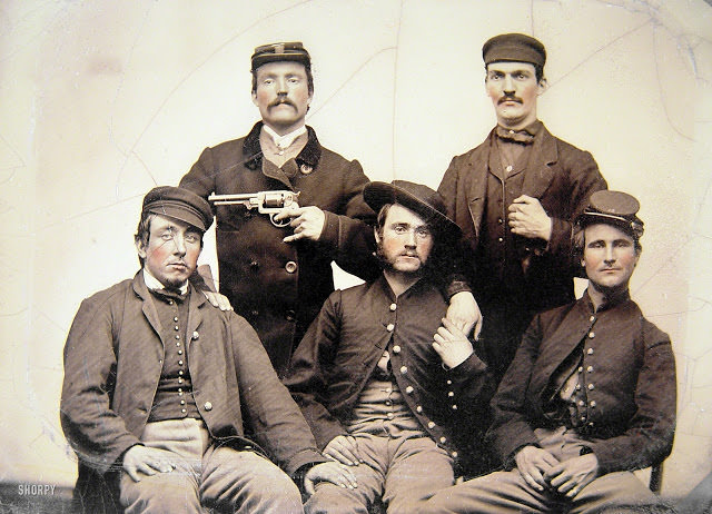 Unidentified men in Union uniforms, one pointing a revolver at another's head