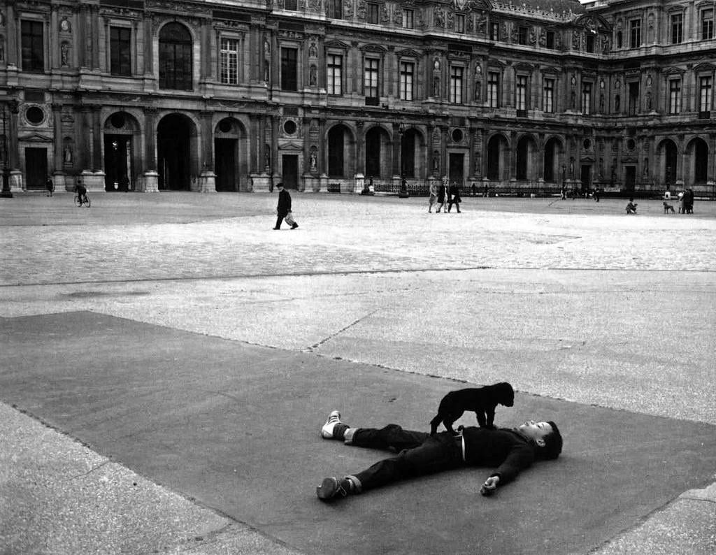 Boy with a puppy at the Louvre, Paris, 1969