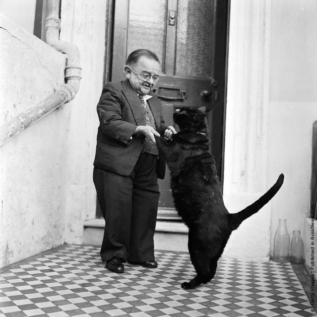 Henry Behrens, The Smallest Man In The World Dances With His Pet Cat, 1956