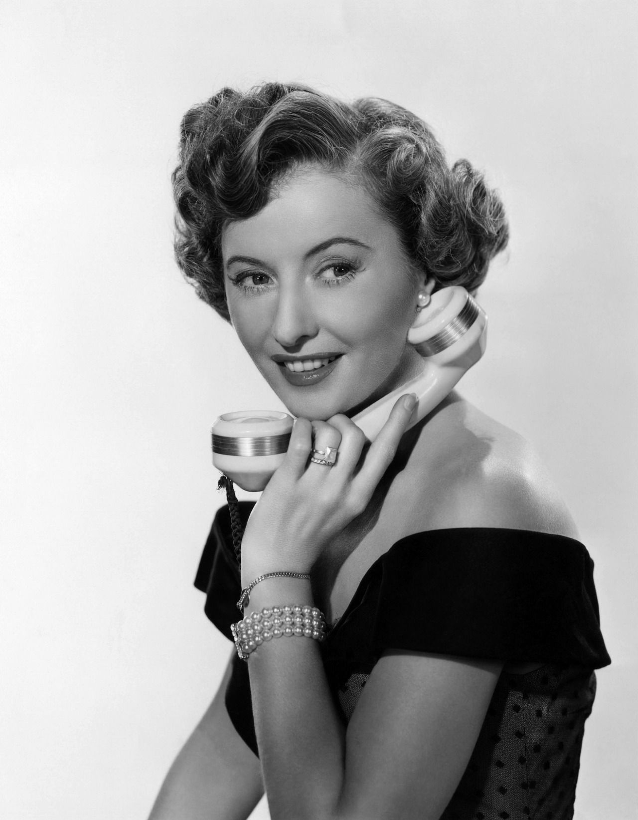 Barbara Stanwyck,on the telephone, 1949