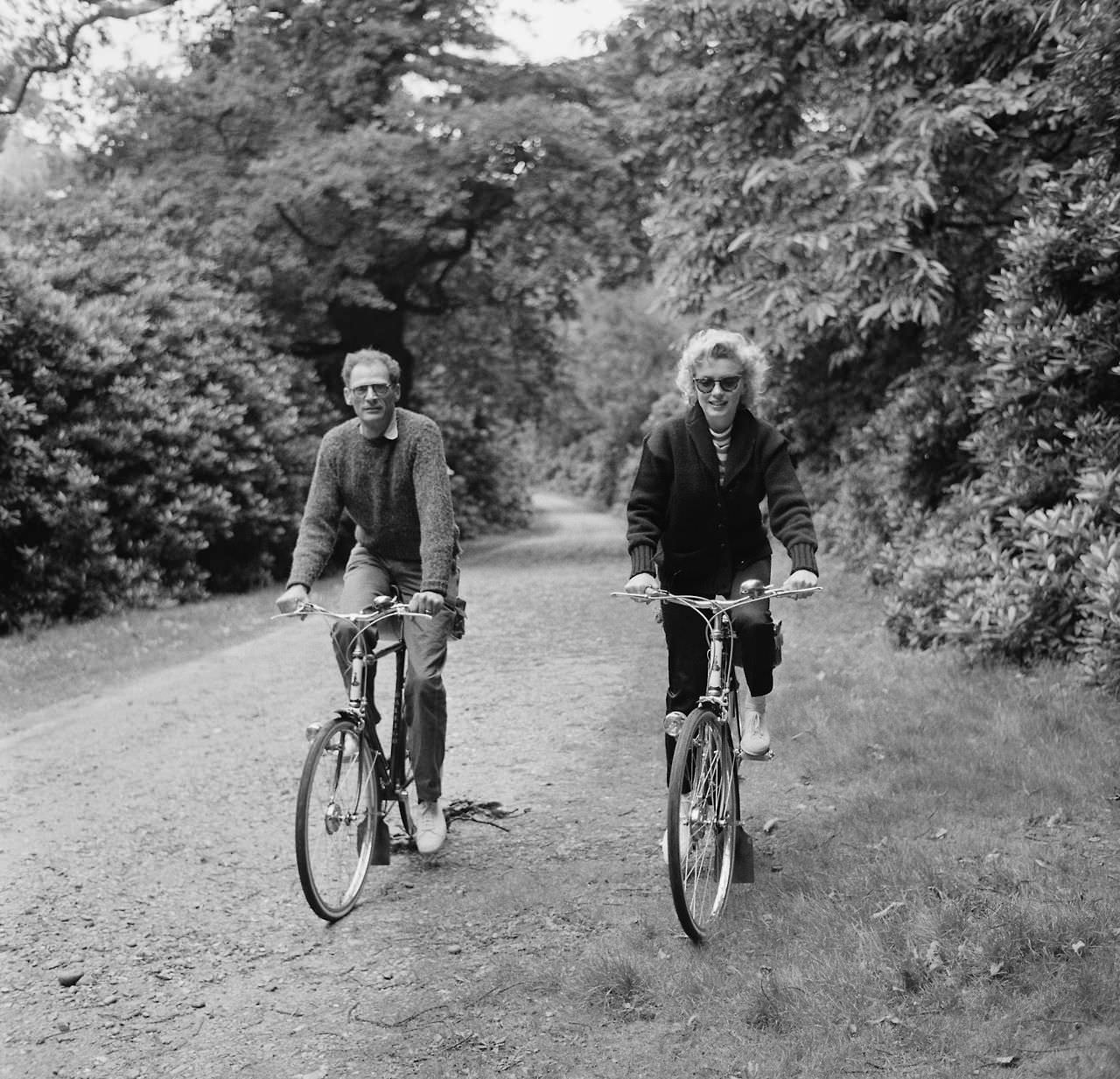 Marilyn Monroe cycling with her husband Arthur Miller, 1956