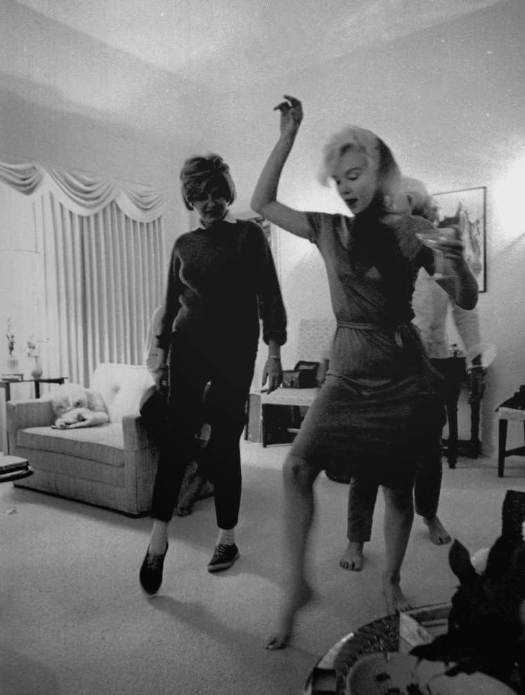 Marilyn Monroe teaching Pat Kennedy Lawford how to dance the "Swing" in 1962