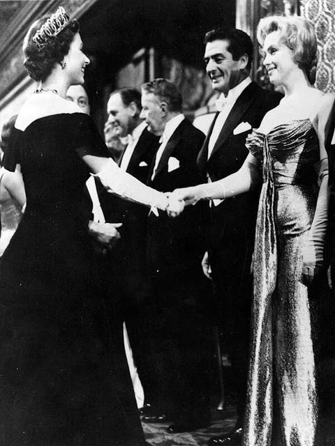Marilyn Monroe and Queen Elizabeth  meet at a movie premier in London, 1956